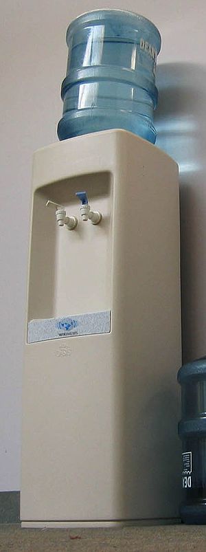 An office water cooler with a reusable 5-gallo...